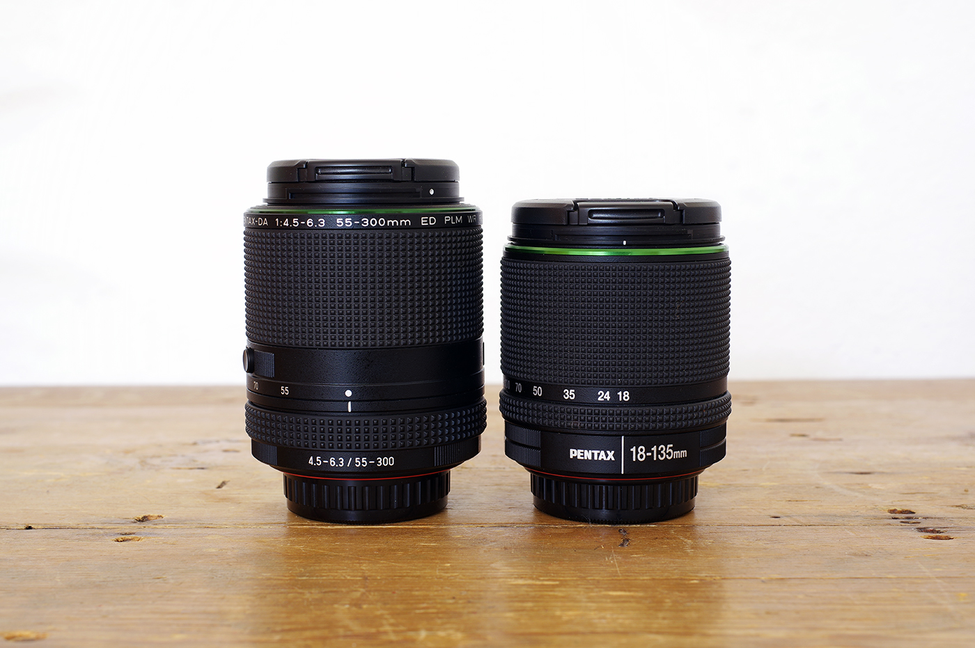 The 55-300mm PLM is slightly longer and wider than the DA 18-135mm WR.